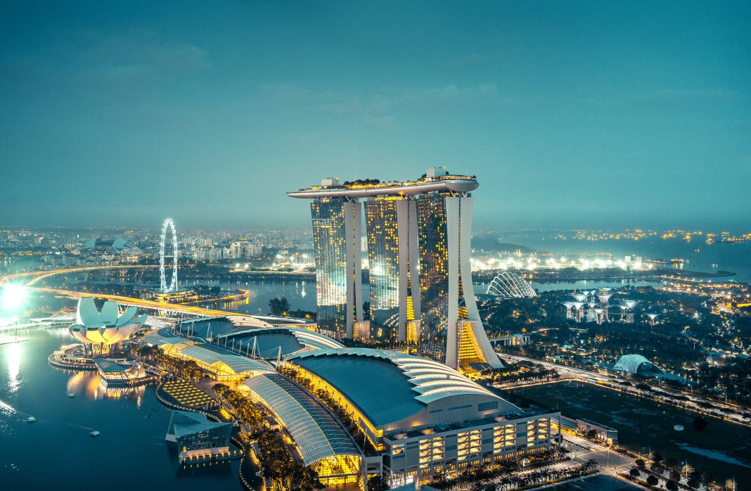 Aerial View Over Singapore to the Marina Bay Sands Hotel at dusk