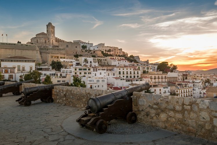 Ibiza fortress and cannon square at sunset. Eivissa island, Spain